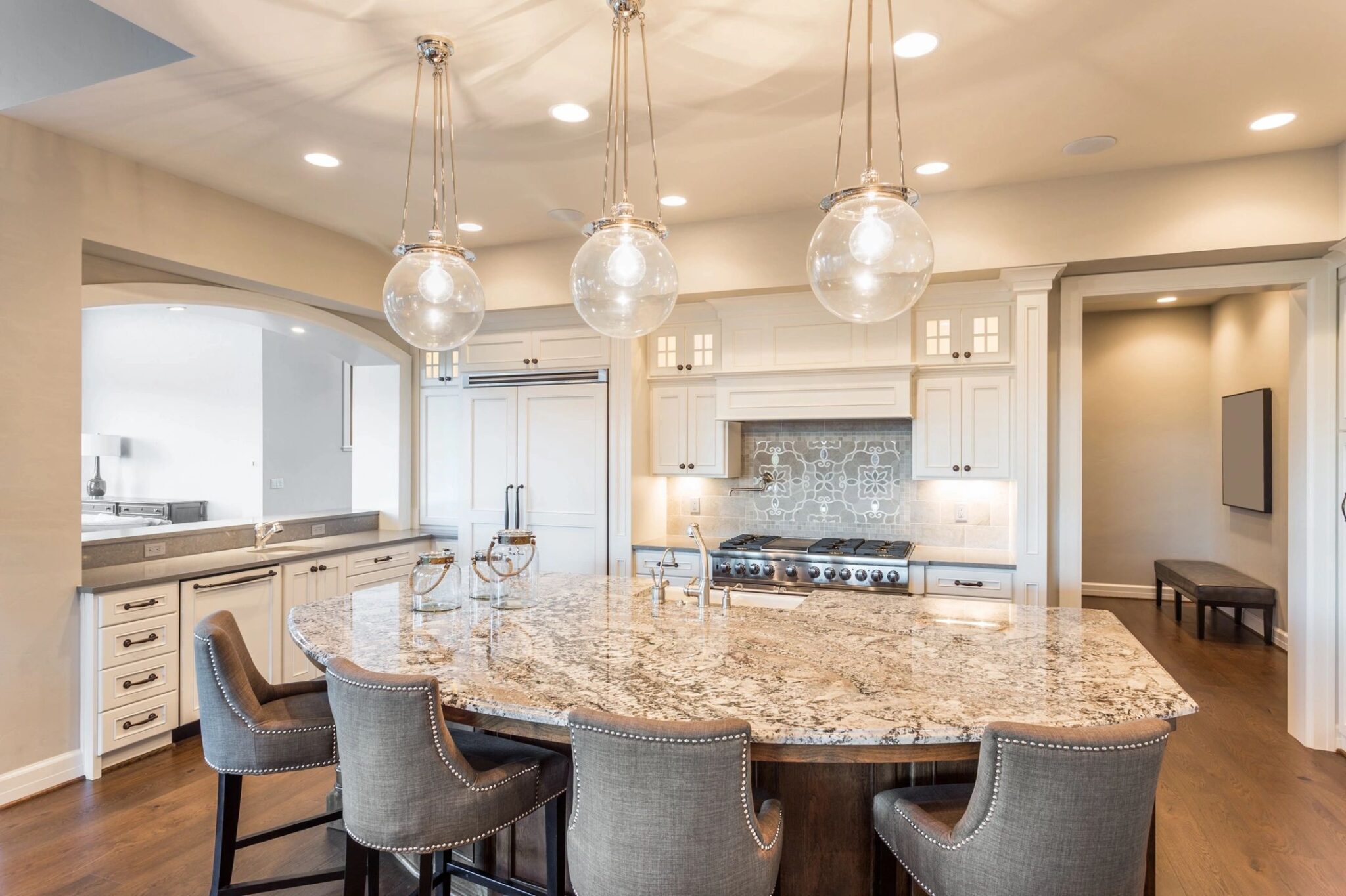 A large kitchen with a round table and chairs