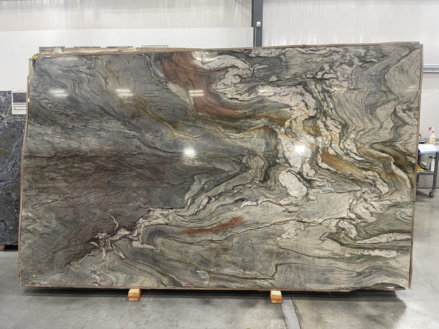 A slab of marble with some brown and green colors