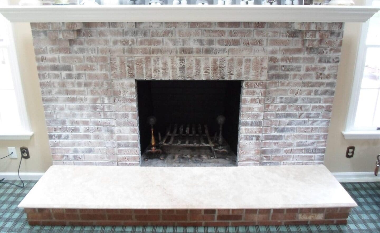 A brick fireplace with a fire place in it