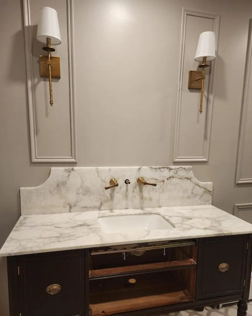 A bathroom with two sinks and a mirror