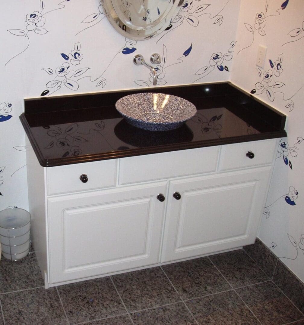 A bathroom with a sink and cabinets in it