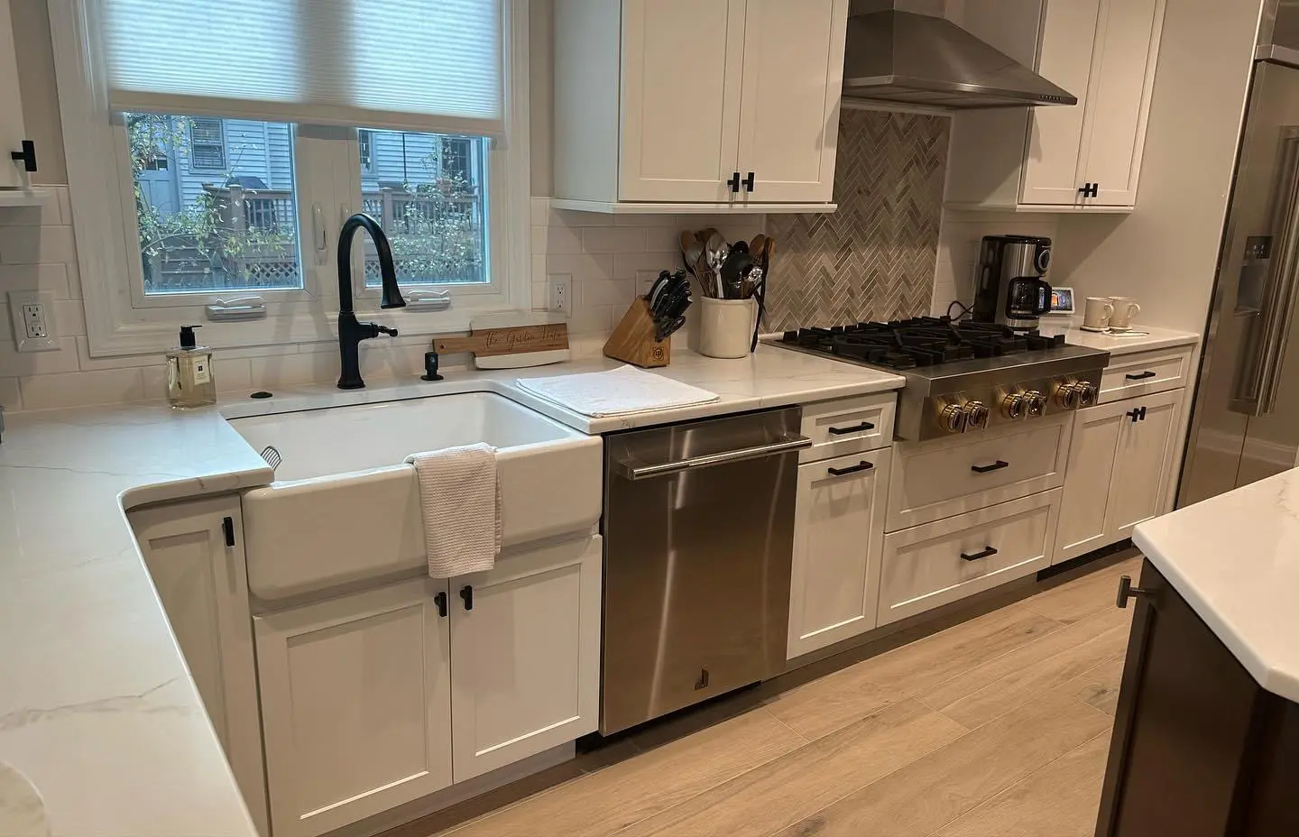 White kitchen with a farmhouse sink.