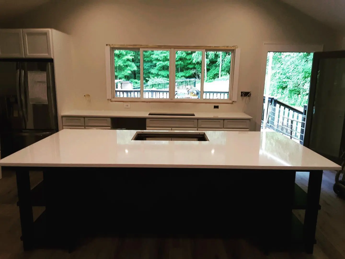 White kitchen island with black base.