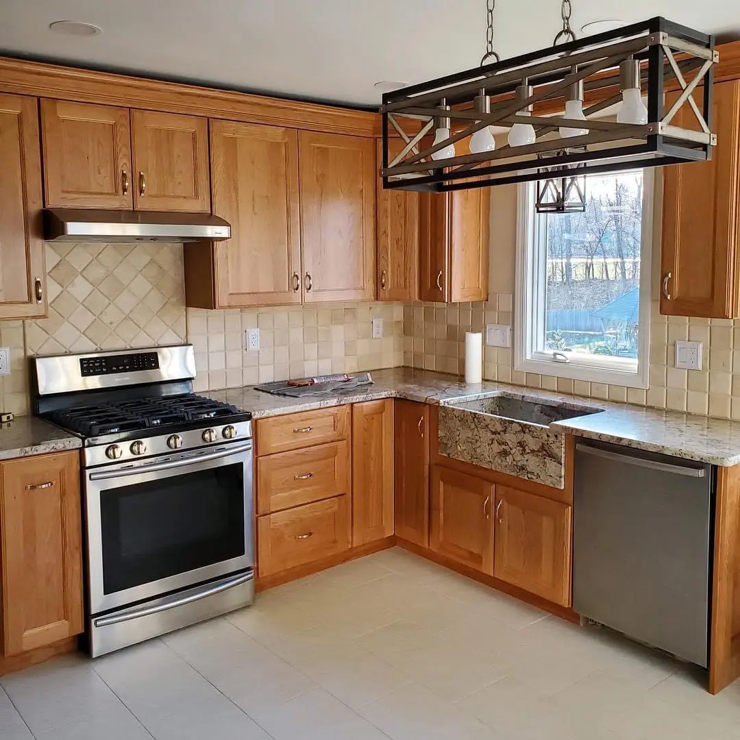 Modern kitchen with farmhouse sink and range.