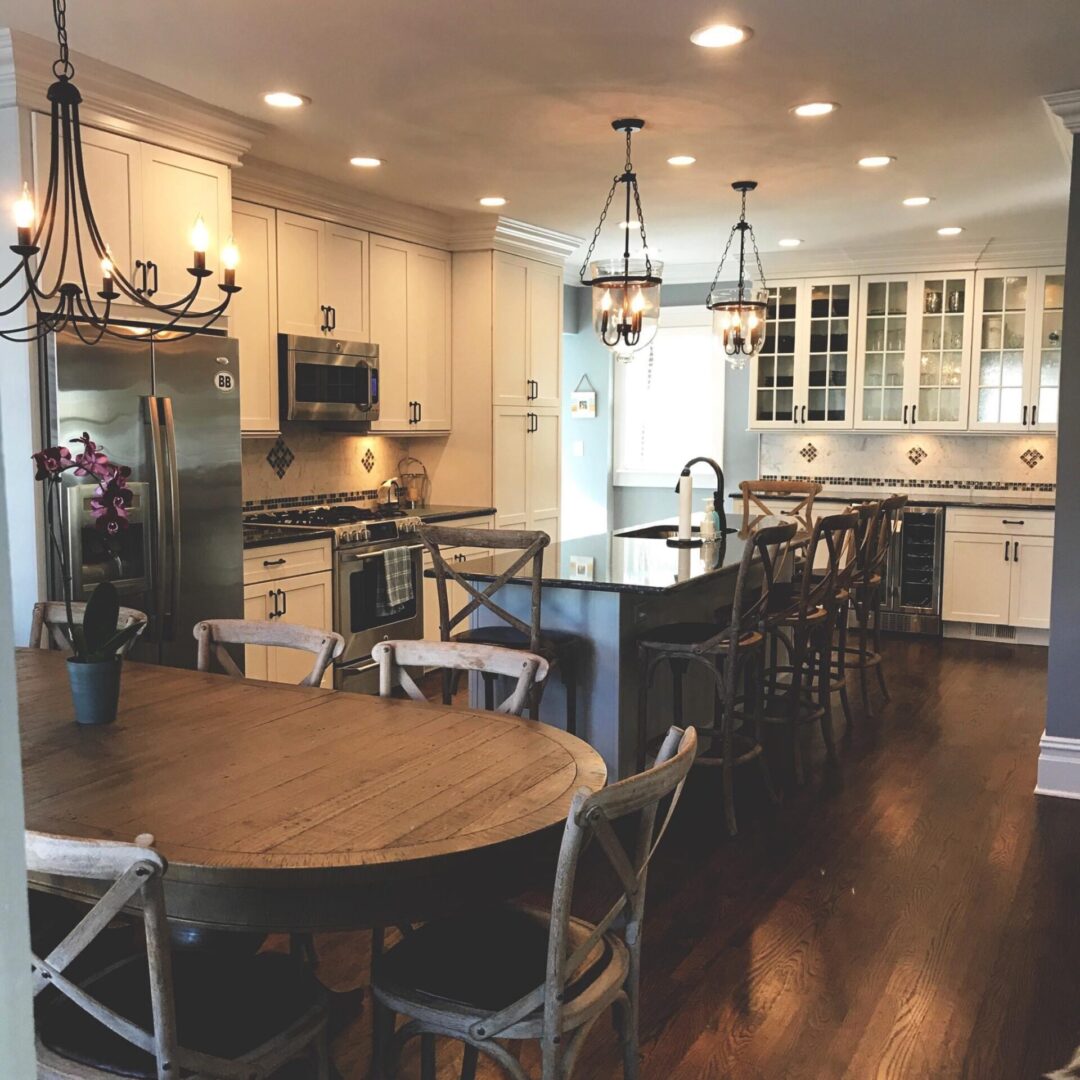 A kitchen with a table and chairs in it