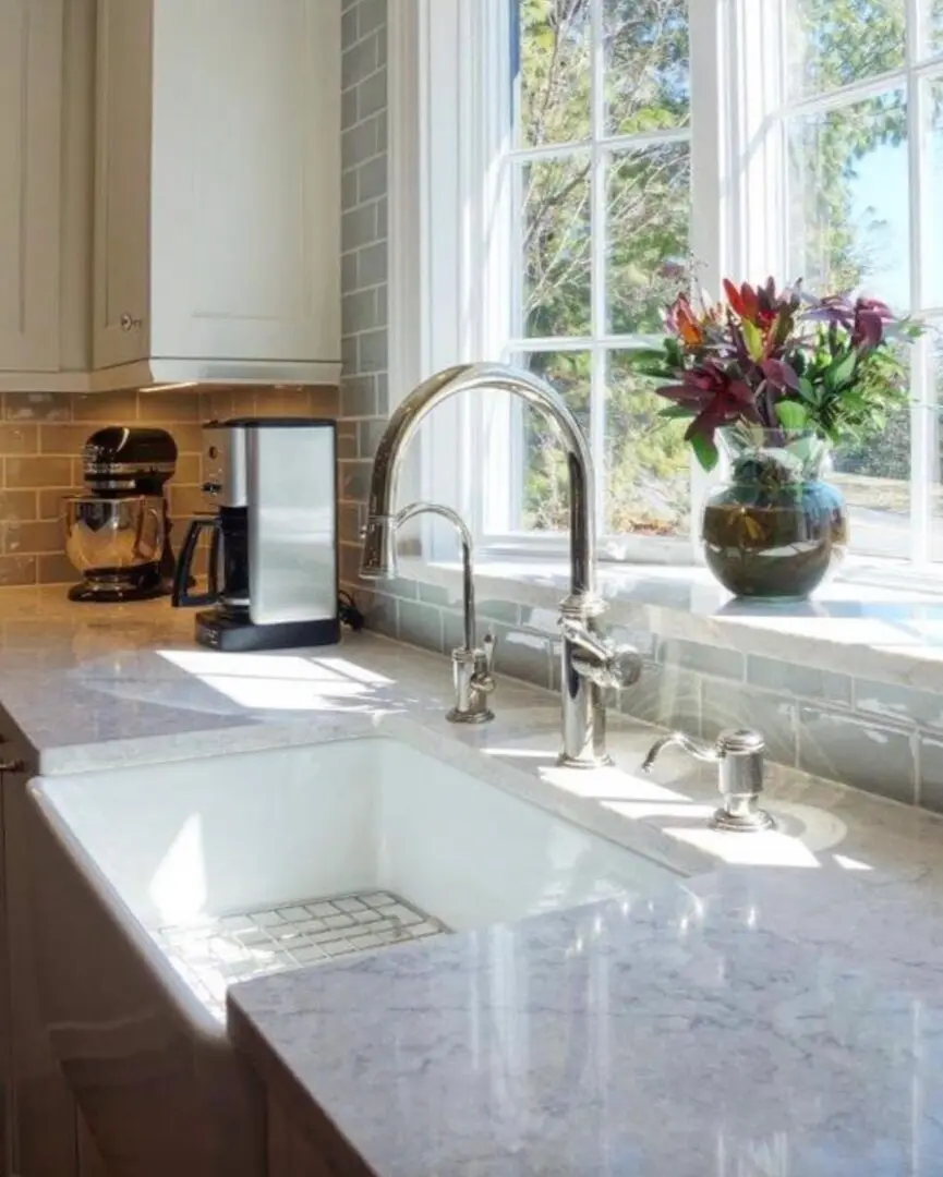 A kitchen with a sink and window in it