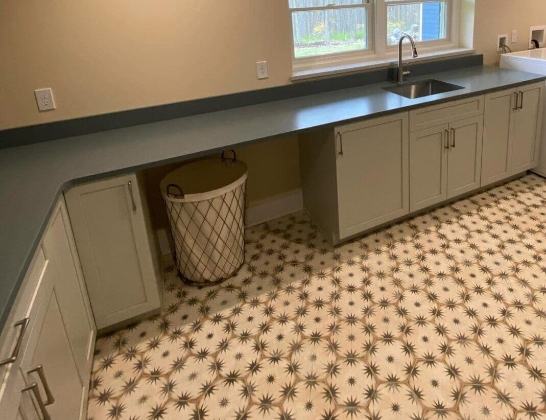 A kitchen with a sink and counter in it