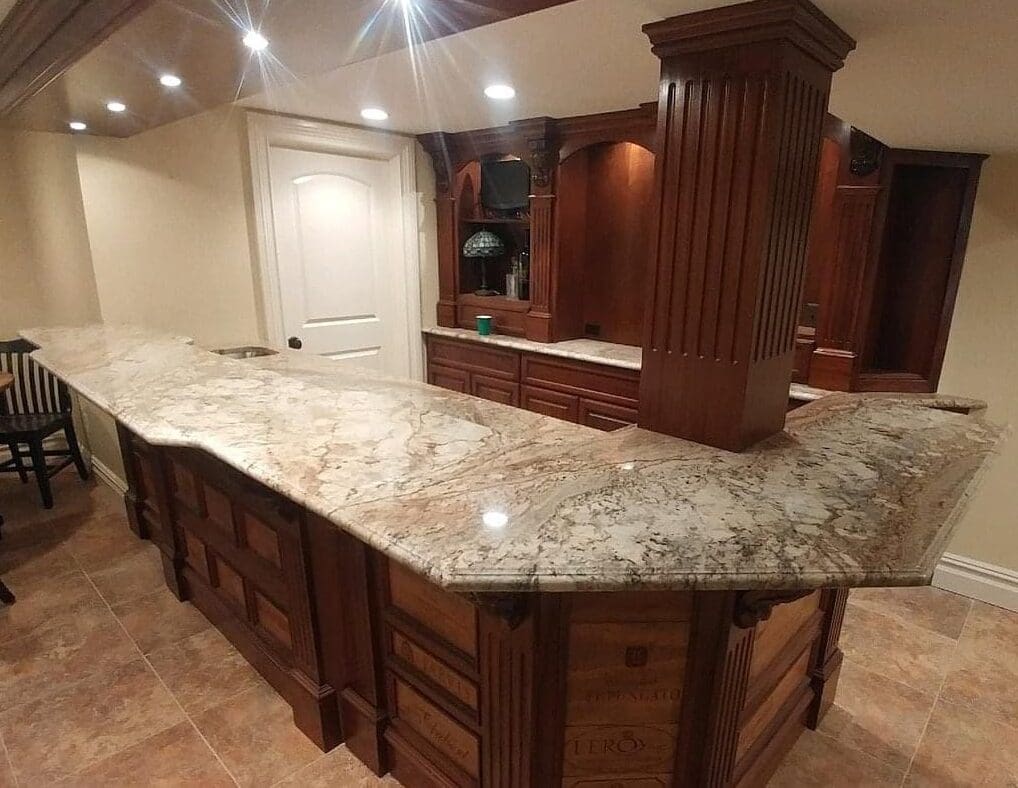 A large kitchen with marble counter tops and wooden cabinets.