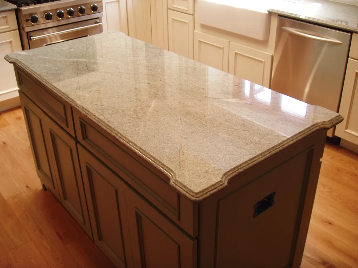 Kitchen island with granite countertop.