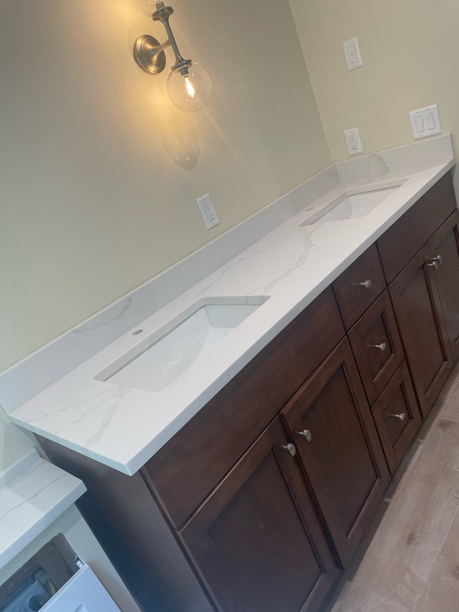 A bathroom with a sink and cabinets in it