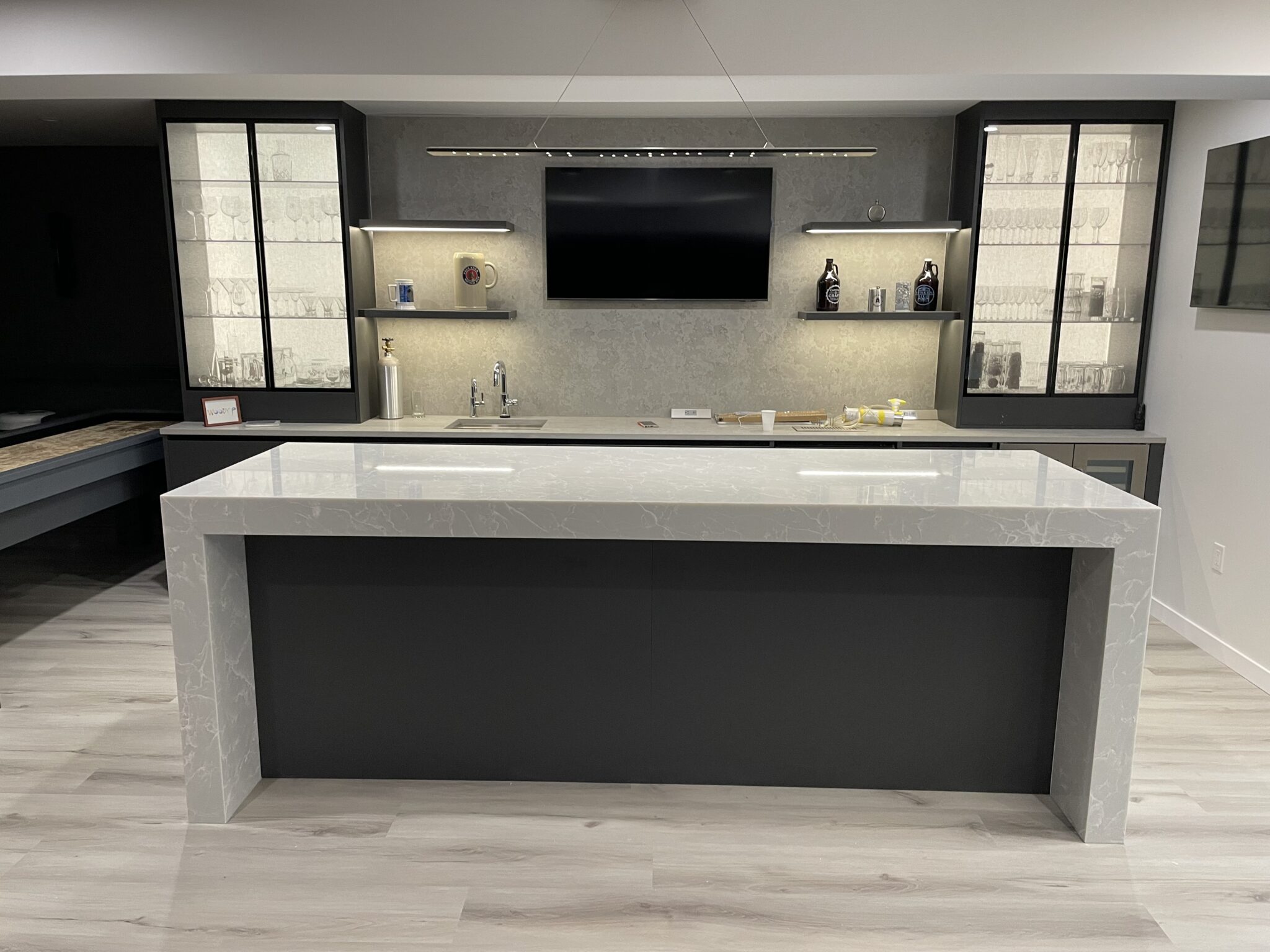 Modern kitchen island with marble countertop.