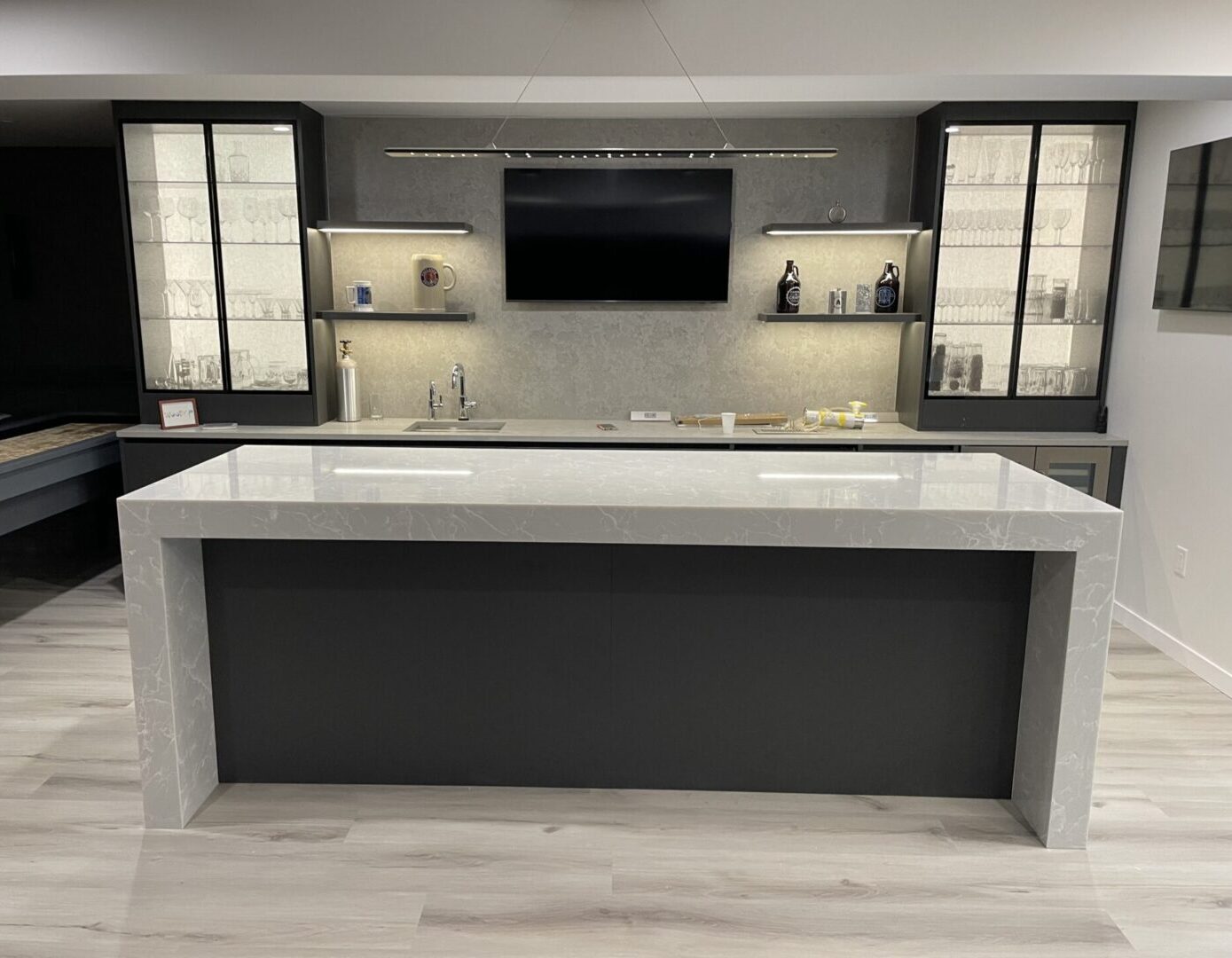 Modern kitchen island with marble countertop.