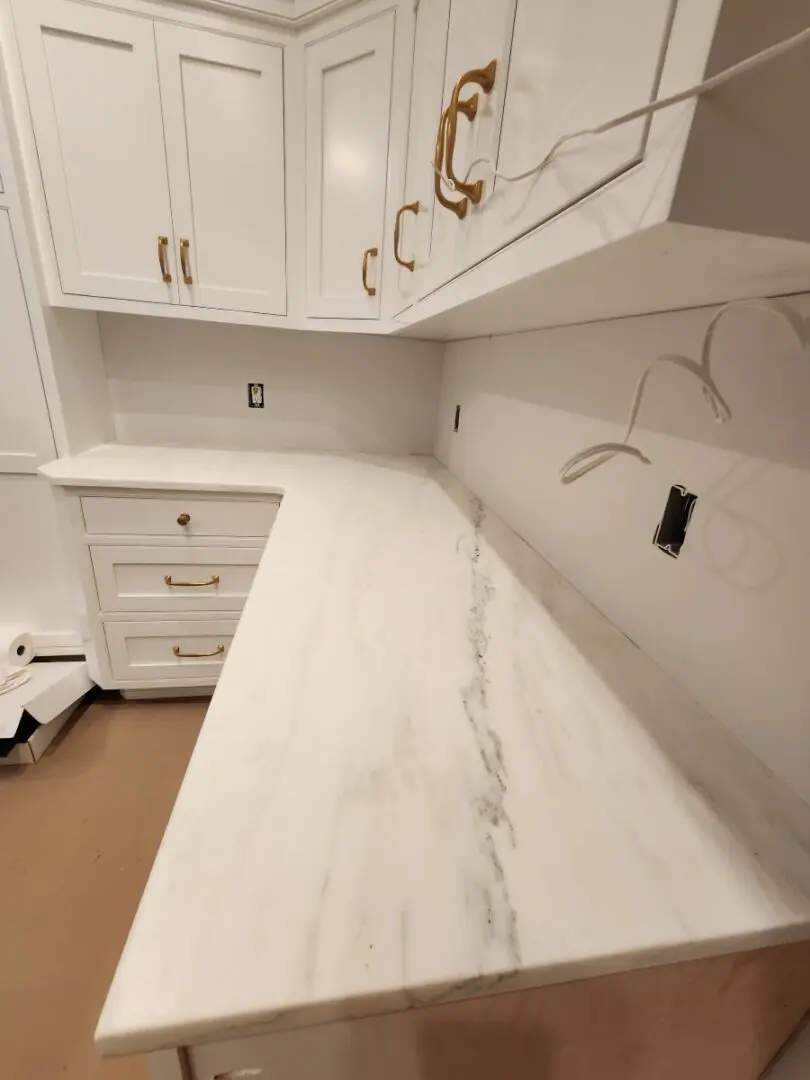 White marble countertop in a kitchen.