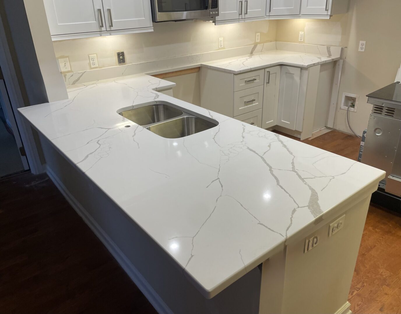 White quartz kitchen island countertop.