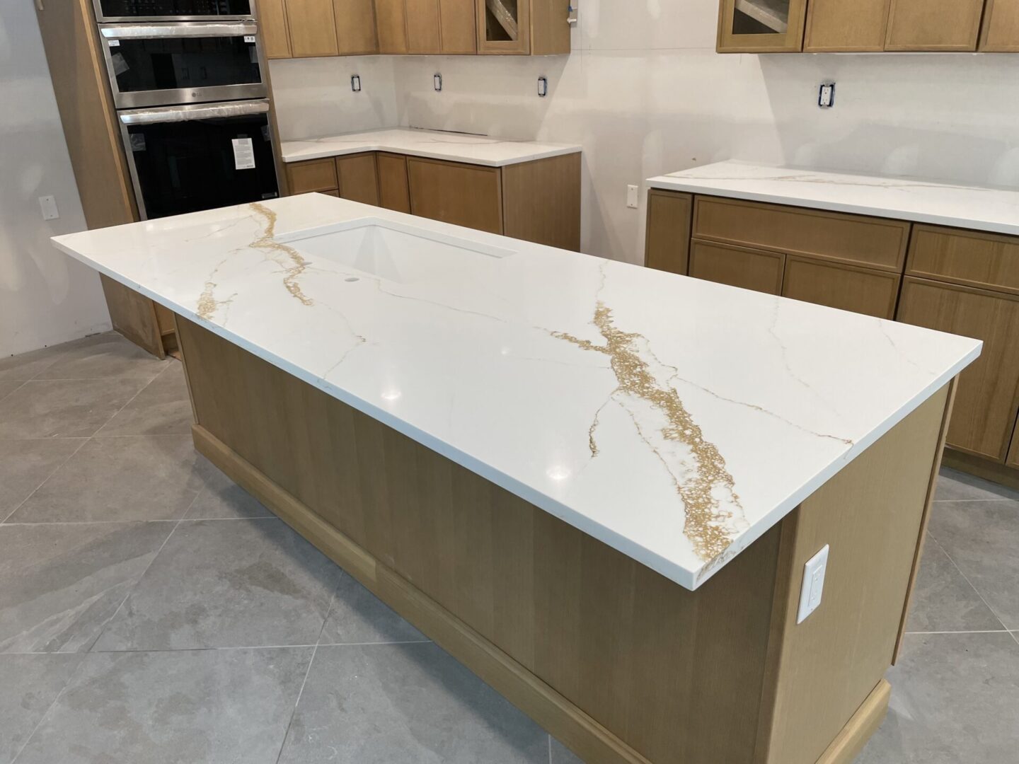 Kitchen island with marble countertop.