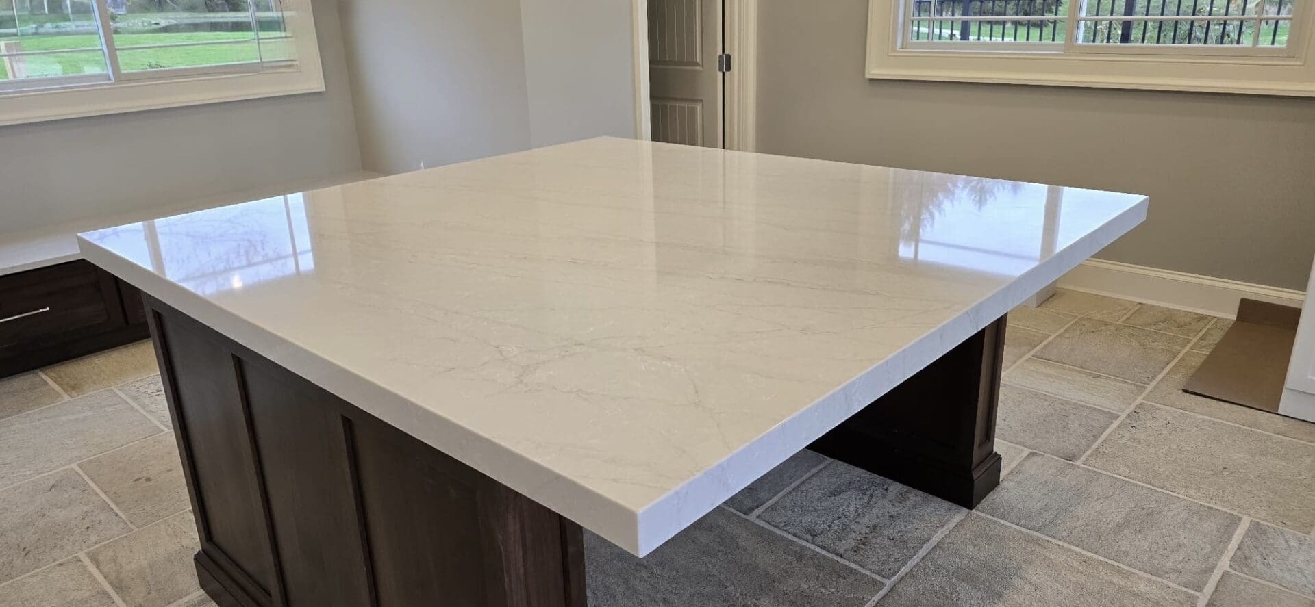 Polished quartz kitchen island countertop.