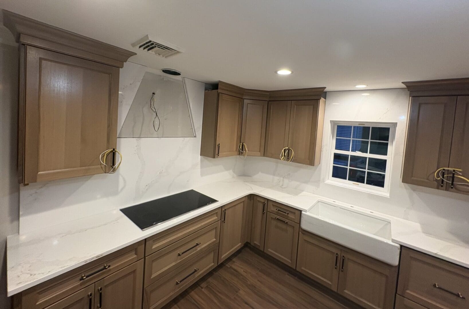 Modern kitchen with wooden cabinets and countertop.
