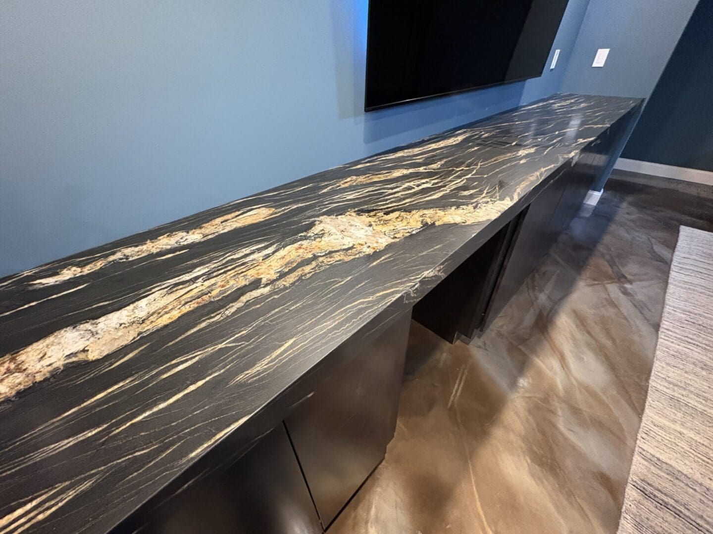 Black marble countertop with gold veining